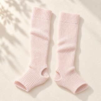 Pink ribbed knit ballet leg warmers with open heel – one pair, flat lay on cream background