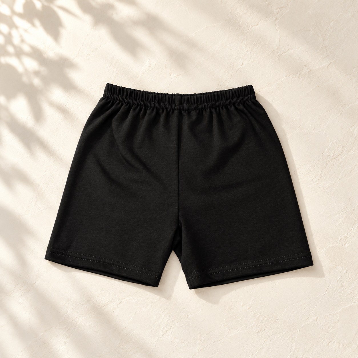 Boys black ballet shorts flat lay