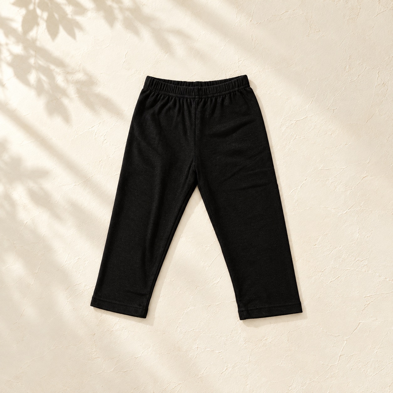 Boys black ballet cropped trousers flat lay