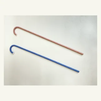 Blue and pink satin-wrapped ballet canes laid side by side