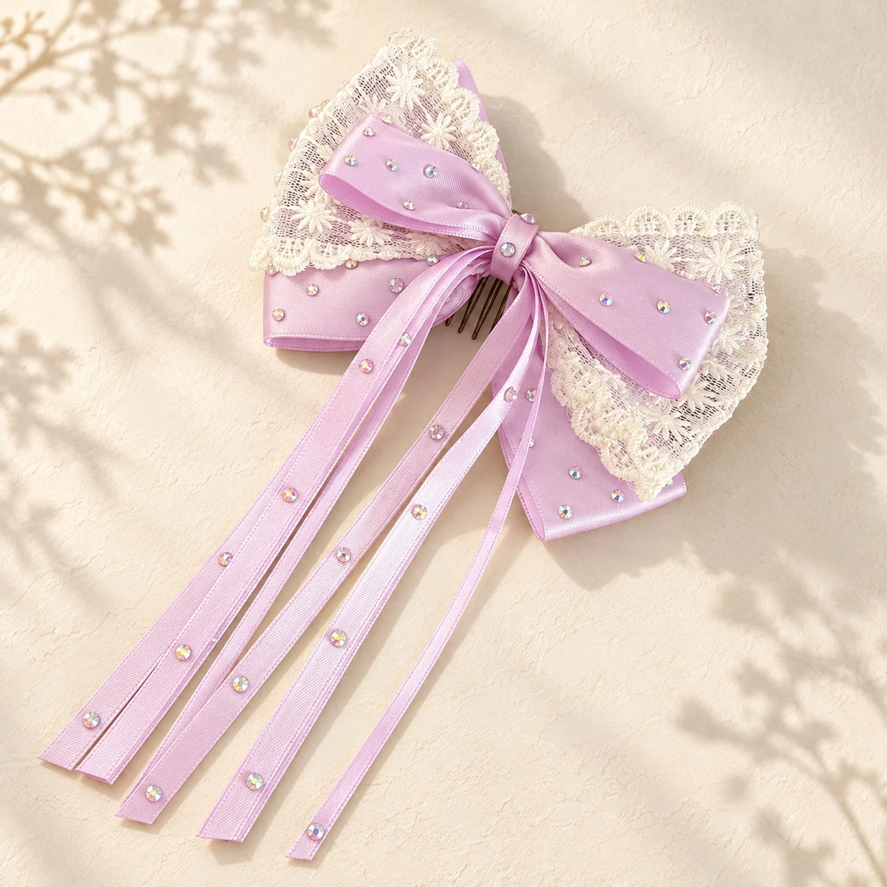 Lilac satin hair bow with white lace and long pearl-studded ribbons