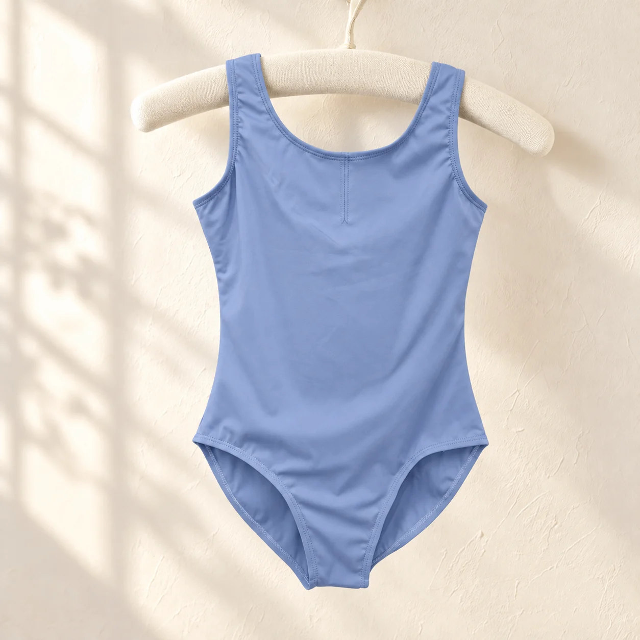 Periwinkle blue sleeveless nylon ballet leotard on a hanger