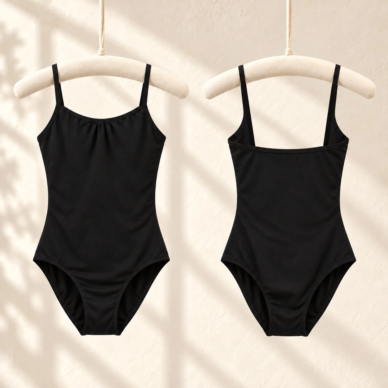Front and back of the black camisole ballet leotard with a clean low square back