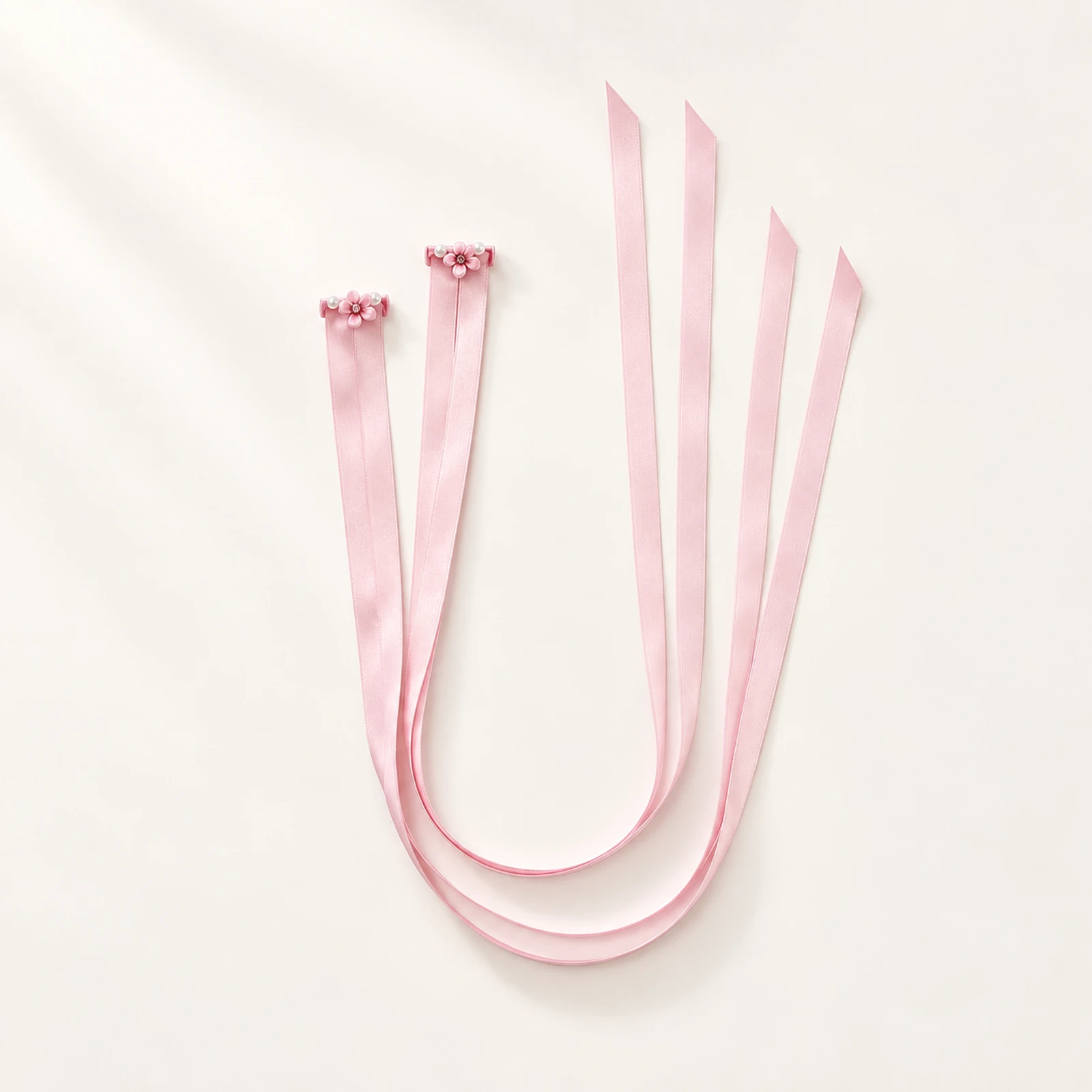 Pair of blush pink satin finger ribbons with small flower loops