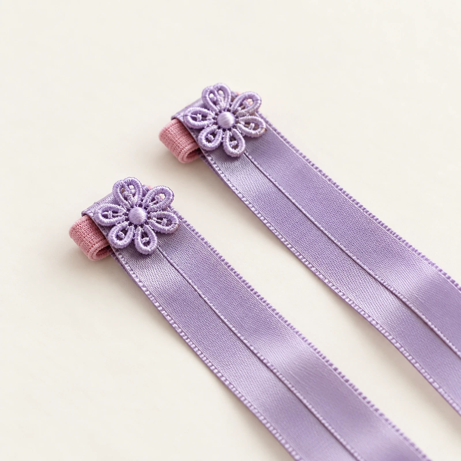 Close-up of the flower finger loop on lavender satin ribbons