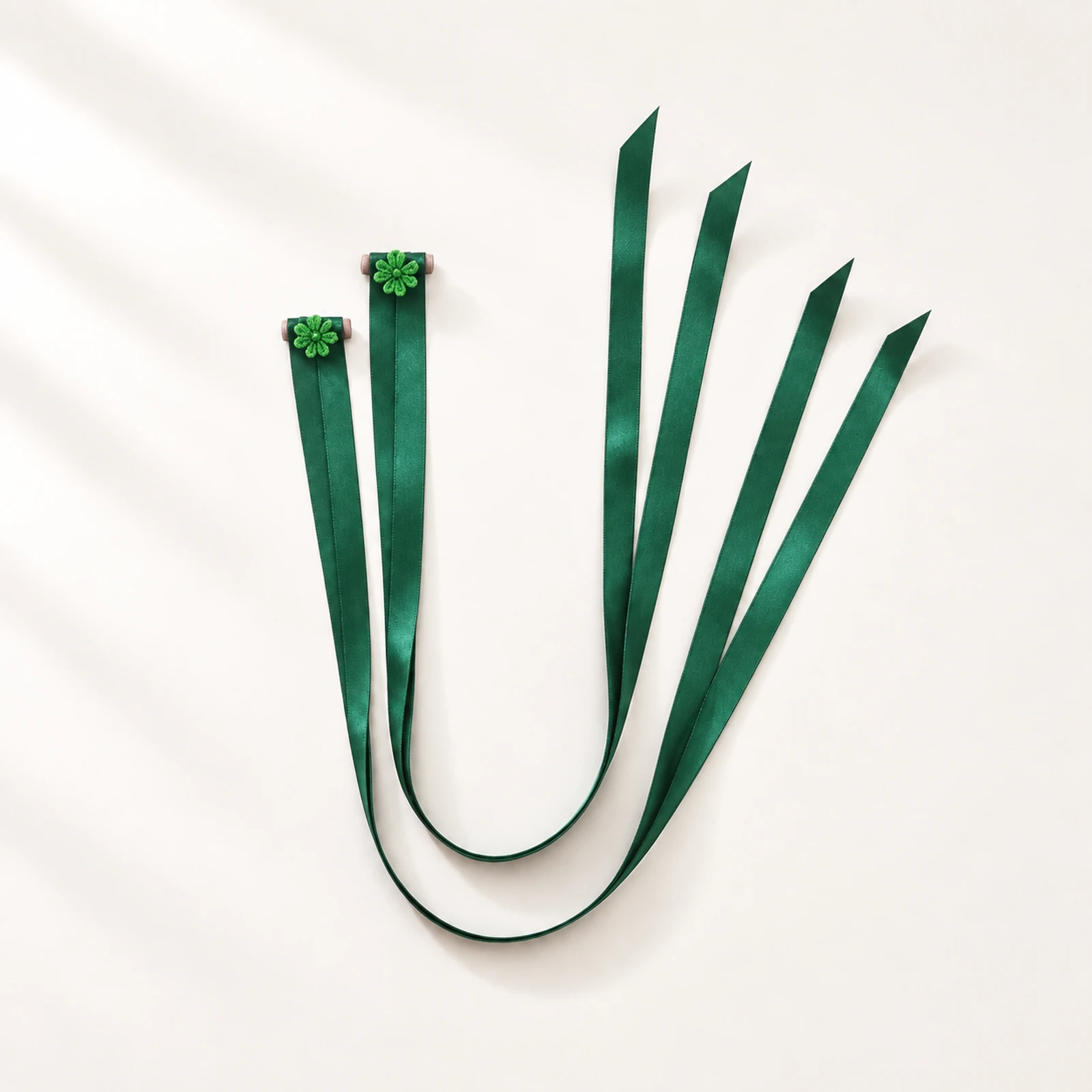 Pair of forest green satin finger ribbons with small flower loops