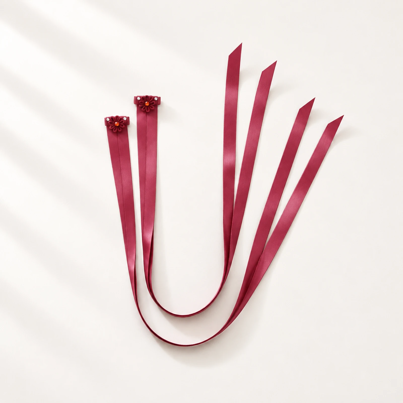 Pair of wine burgundy satin finger ribbons with small flower loops