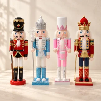 Four painted nutcracker figures in red, ice blue, pink and red and navy standing in a row