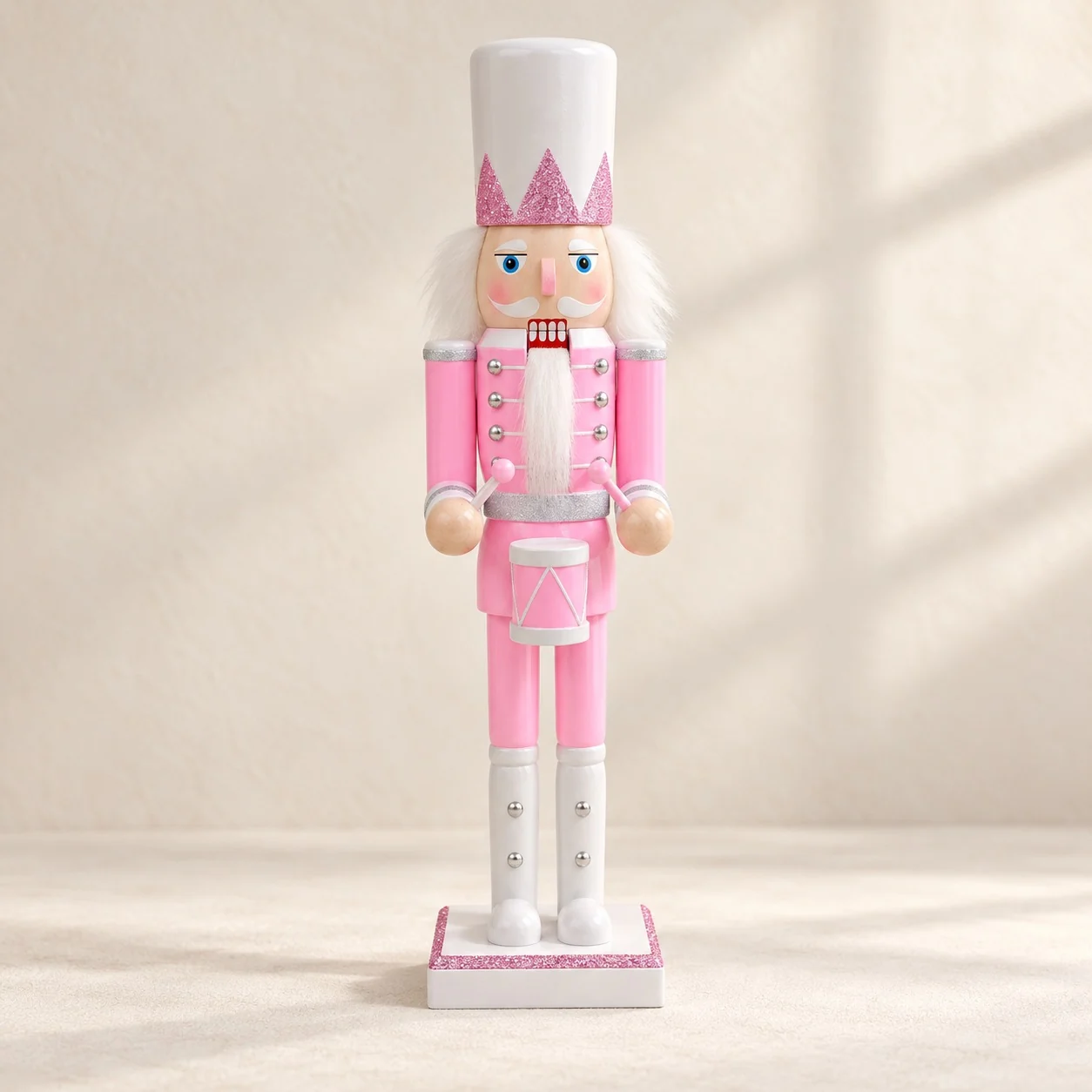 Pink nutcracker with a tall white hat