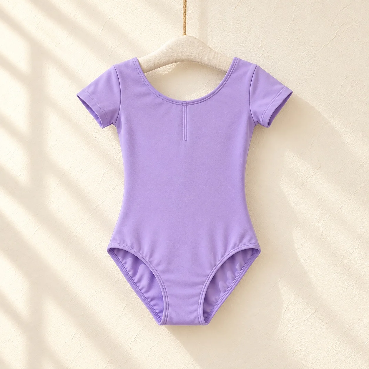 Front of the lavender short-sleeve ballet leotard with a round neckline on a hanger