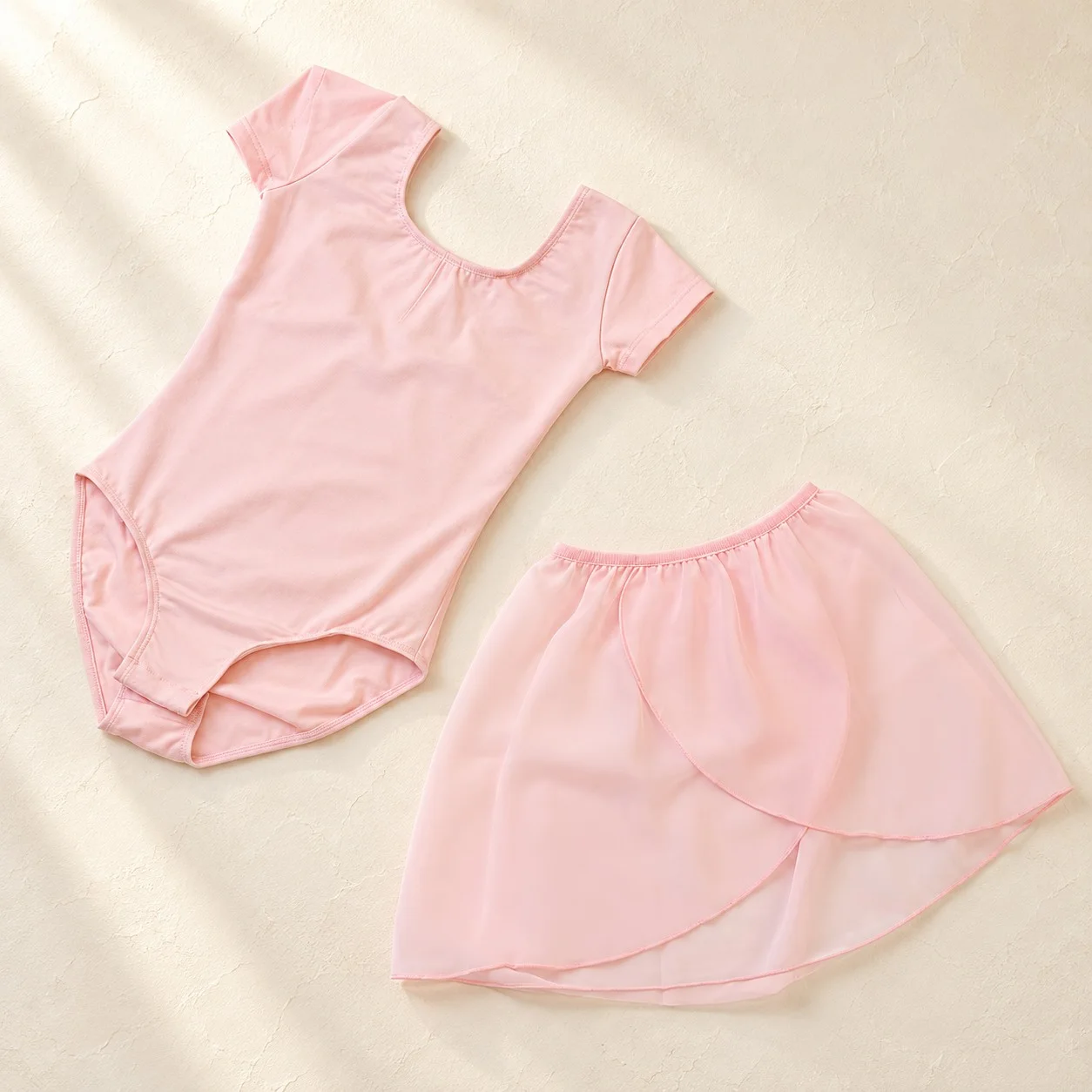Pale pink short-sleeve ballet leotard with a matching pale pink chiffon skirt