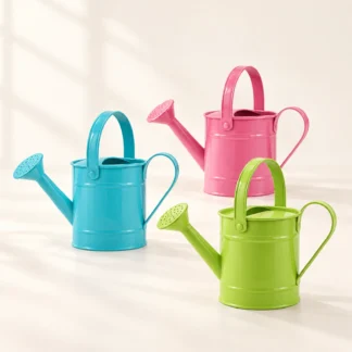 Three metal watering can props in pink, blue and lime green