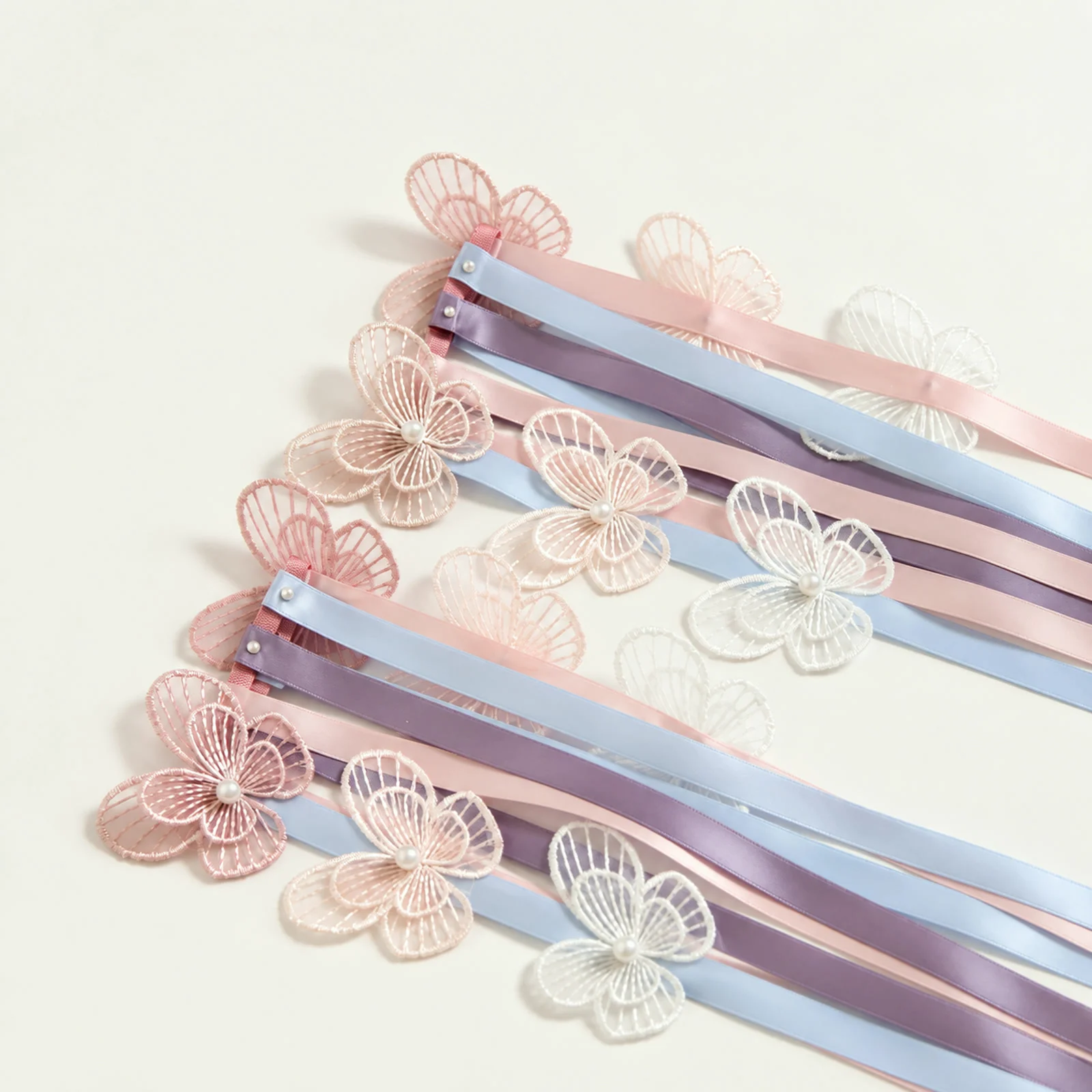 Close-up of the lace butterflies and satin ribbons