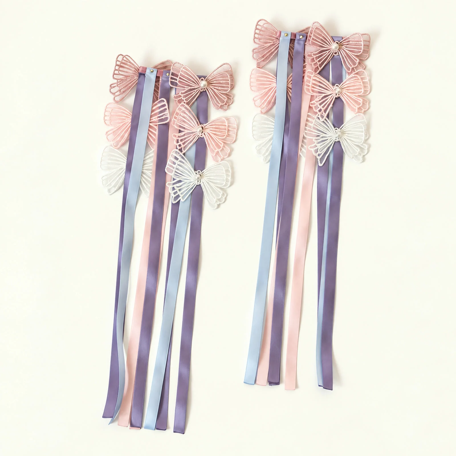 Pair of butterfly wrist ribbons with lilac, pink and blue satin ribbons